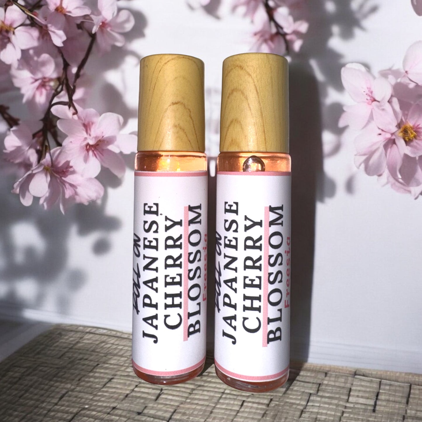 Japanese Cherry Blossom Perfume Roll On (Cherry blossom and freesia unfold to reveal dramatic tones of exotic sandalwood, oak and fruit wood. A background of clear musk and dark amber)